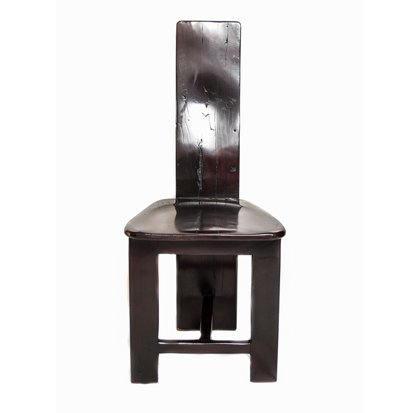 Chair with a tall, flat back panel, made from recycled red jarrah wood in Zimbabwe