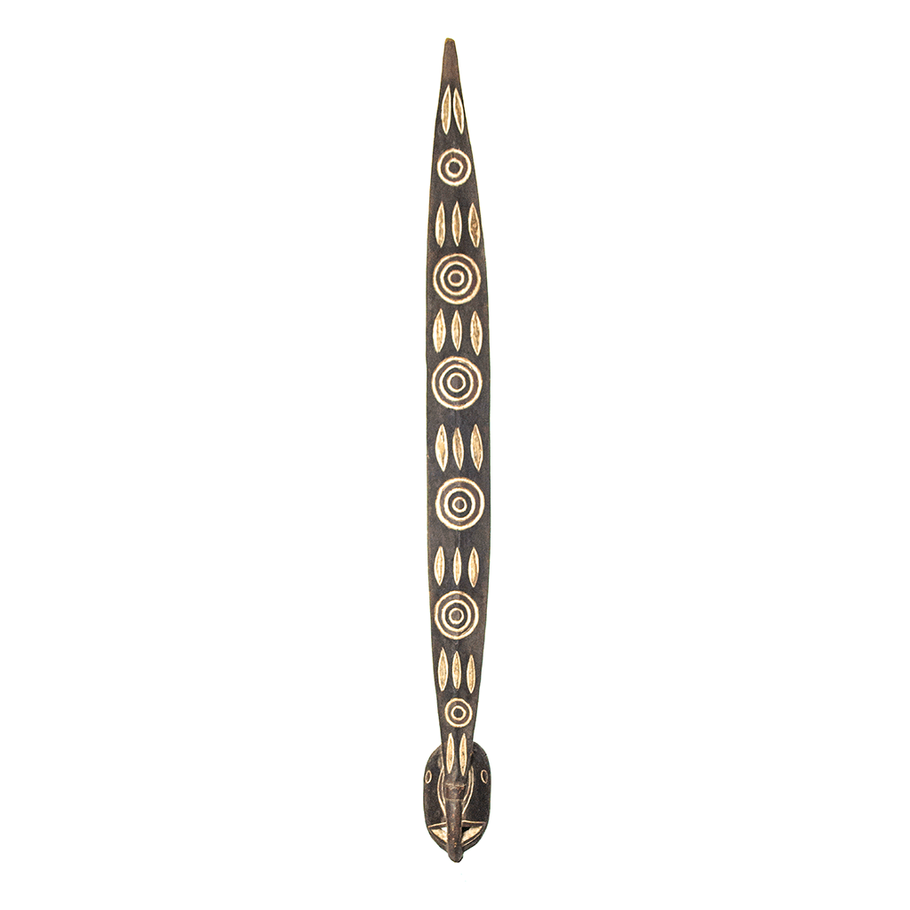 Mask, a tall Mossi mask carved from dark wood in Burkina Faso, painted with white circles and leaf shapes down its length