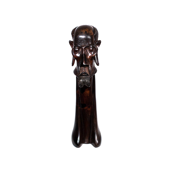 Masaai Tribe, a Masaai elder's head with stretched earlobes and a beard, carved from ebony wood in Kenya