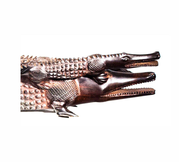 Crocodile, a small crocodile riding on the back of a larger one, carved from ebony wood in Kenya
