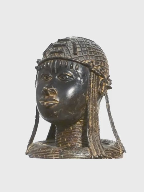 Benin Kingdom Woman turning on a stand, video