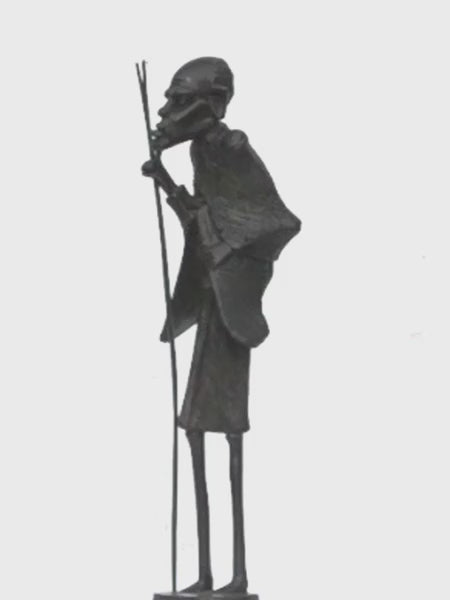 Masaai Old Man turning on a stand, video