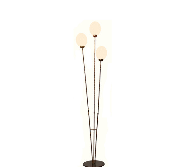 Full view of the Three Egg Ostrich Egg Lamp with three lit eggs on thin metal stems and a round base