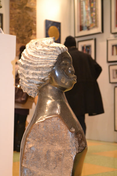 Profile view, On Display at the Harlem Fine Arts Show in NYC: Hand Carved Stone Sculpture 'Shona Girl' by Zimbabwean Artist C. Mukavai Made in 1990