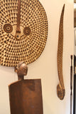 On the left, On display at the Harlem Fine Arts Show in NYC: Authentic Mask from Burkina Faso Made in 1963