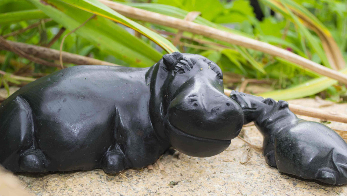 Hippos, a smiling large and small hippo carved from serpentine stone in Zimbabwe by Shona artist Rose Chakanyuka