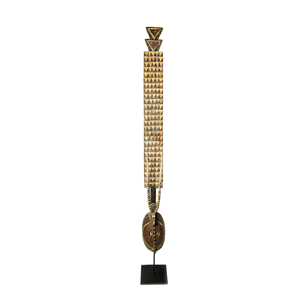 Mossi Tribe Mask, a tall Mossi plank mask carved from wood in Burkina Faso, covered in rows of small triangles, on a stand
