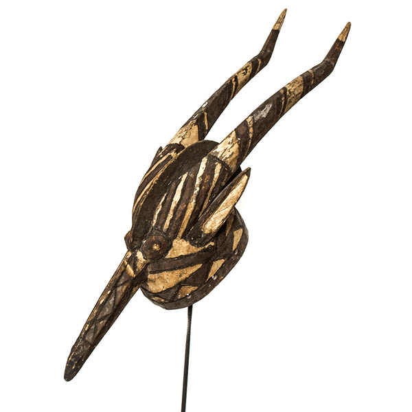 Mossi Tribe Mask, a Mossi antelope mask carved from wood in Burkina Faso, painted black and white with two long curved horns