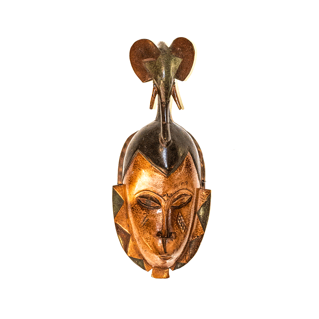 Guro Mask, a copper colored face mask topped with a small elephant, carved from wood by the Guro people of Ivory Coast