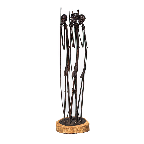 Masaai Tribe, a tall group of Masaai men holding long staffs, carved from ebony wood in Kenya by Ndonye Mwanzilo