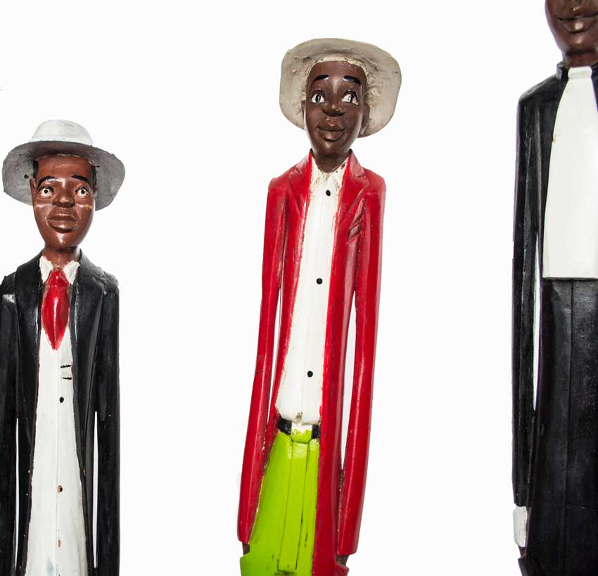 Colonial People, painted figures carved from wood in Ivory Coast, men in suits, hats and red ties