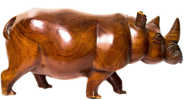 Rhino, a walking rhinoceros carved from teak wood by Chewa carvers in Malawi, with a smooth polished body and two horns